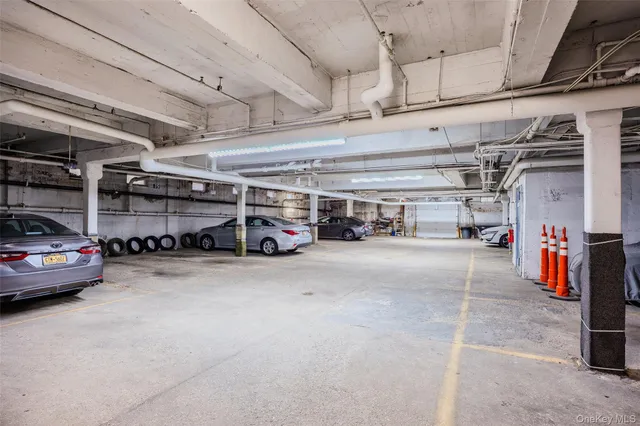 a view of parking garage with cars