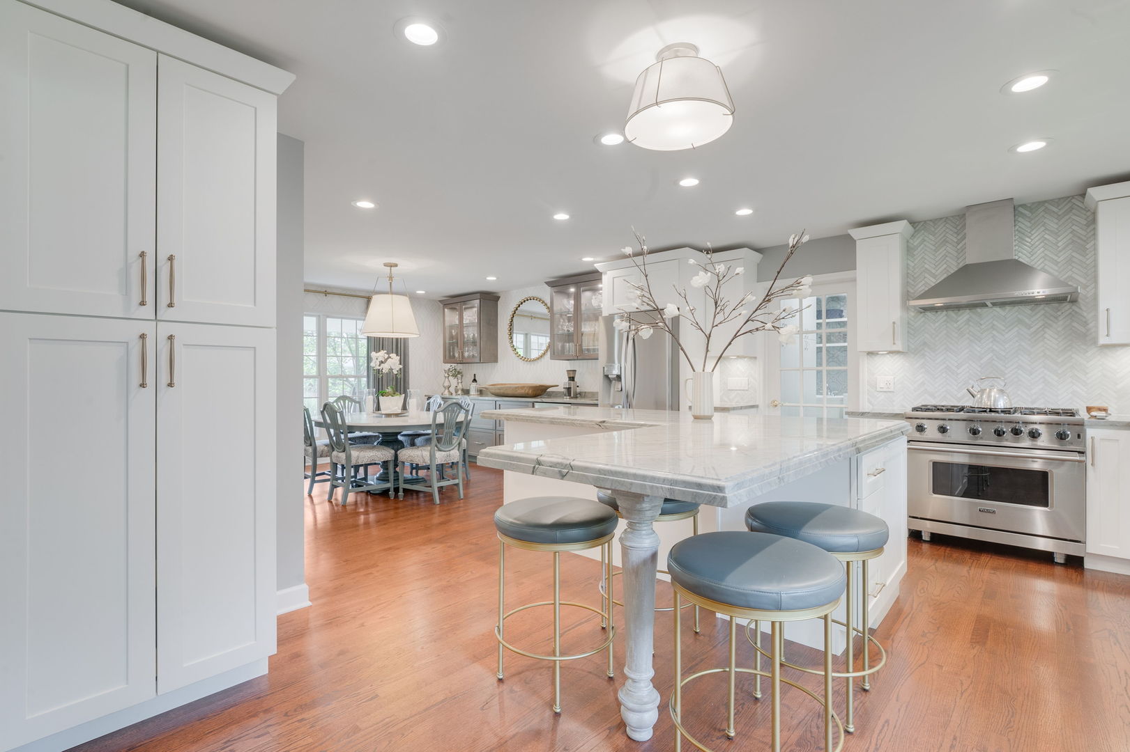 2022 Brandon Road Glenview, IL 60025 - Photo 12 of 35 a kitchen with stainless steel appliances granite countertop a stove and a wooden floors