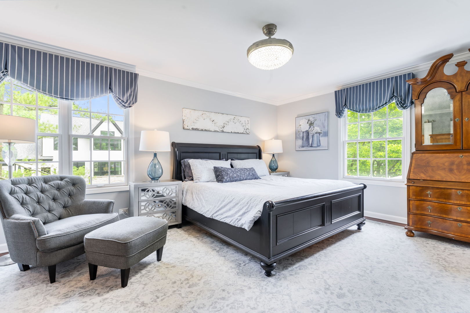 2022 Brandon Road Glenview, IL 60025 - Photo 22 of 35 a bedroom with a bed and a chandelier