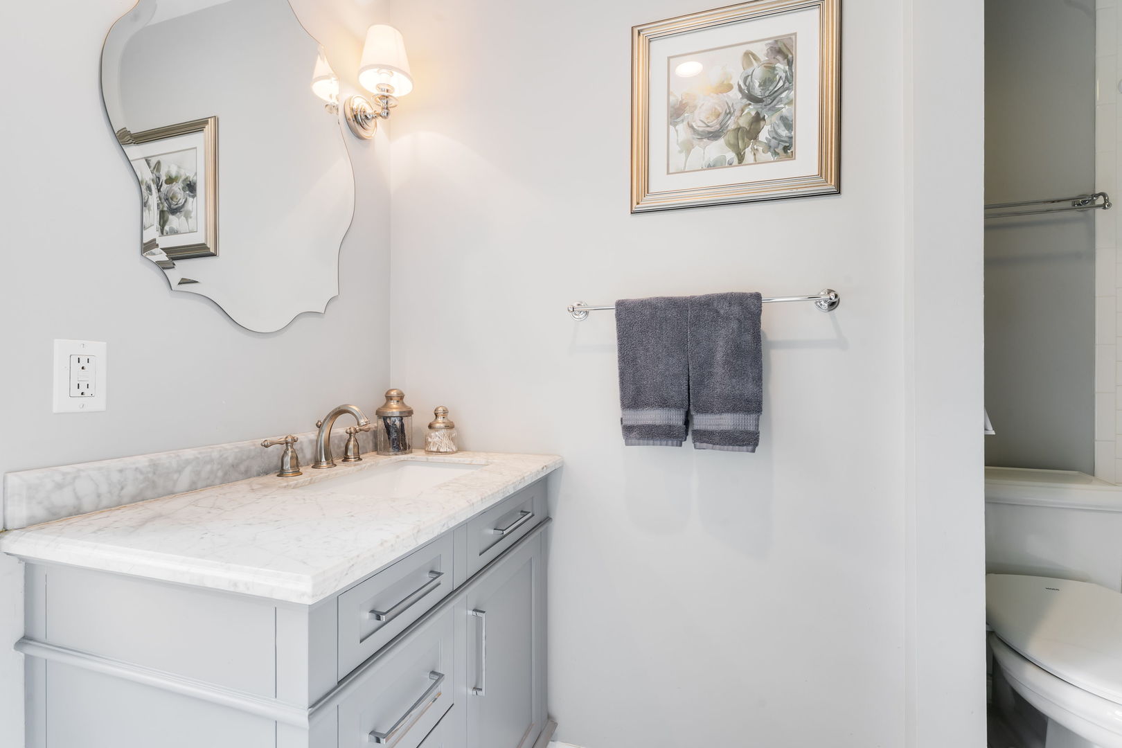 2022 Brandon Road Glenview, IL 60025 - Photo 24 of 35 a bathroom with a sink vanity and a mirror