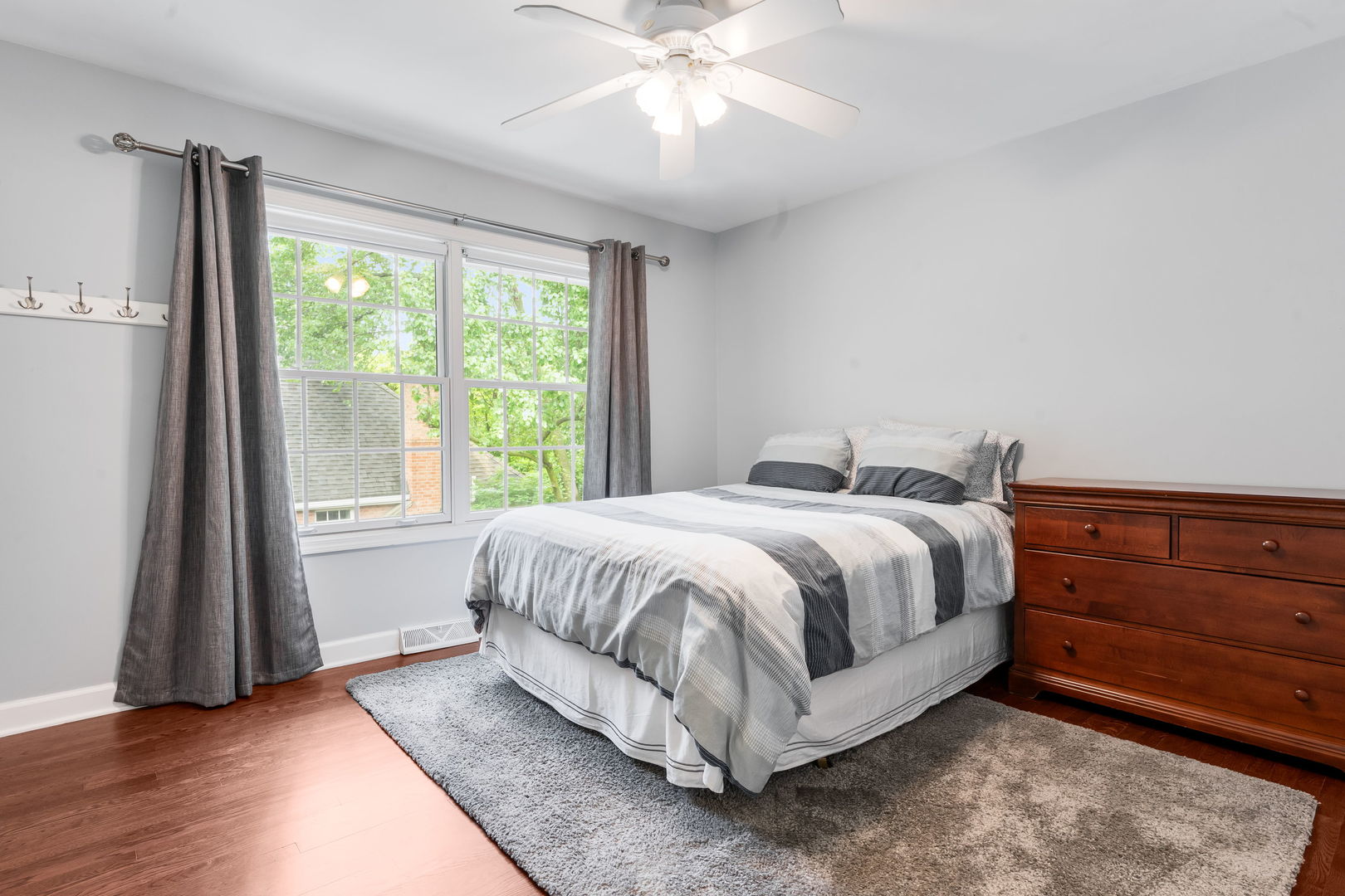 2022 Brandon Road Glenview, IL 60025 - Photo 25 of 35 a spacious bedroom with a bed and a large window