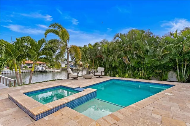 a view of a swimming pool with a lounge chairs