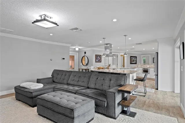 a view of walk in closet with clothes