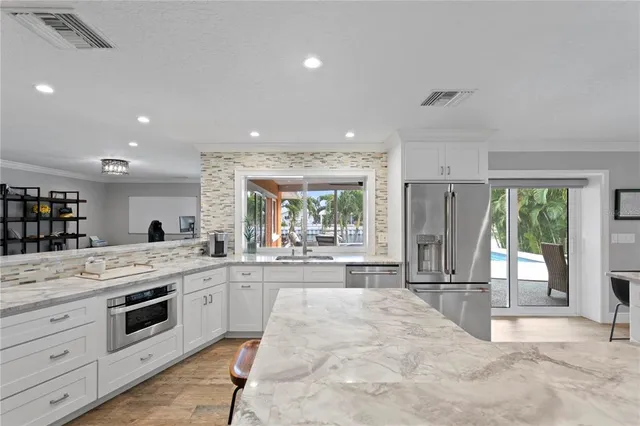 a view of a livingroom with furniture and a flat screen tv