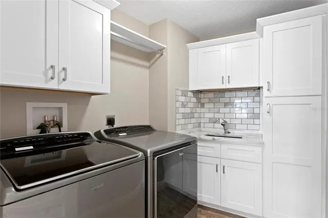 a balcony with furniture and large windows