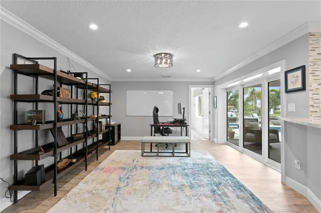 a dining room with furniture and front door
