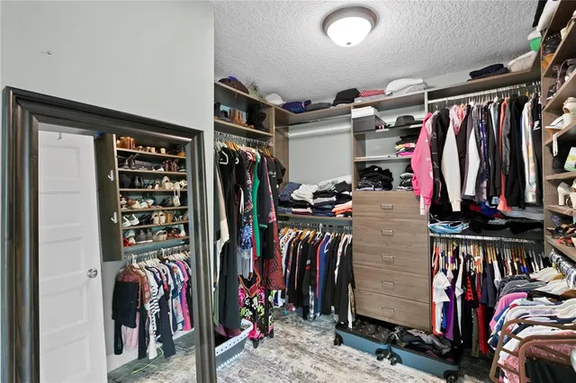 an aerial view of a house with swimming pool lake view and mountain view