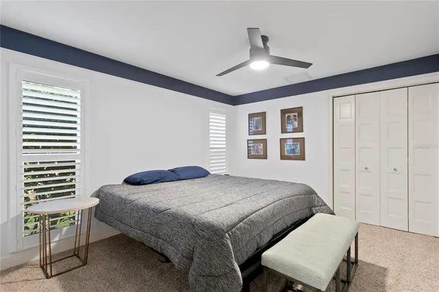 an aerial view of residential houses with outdoor space and swimming pool