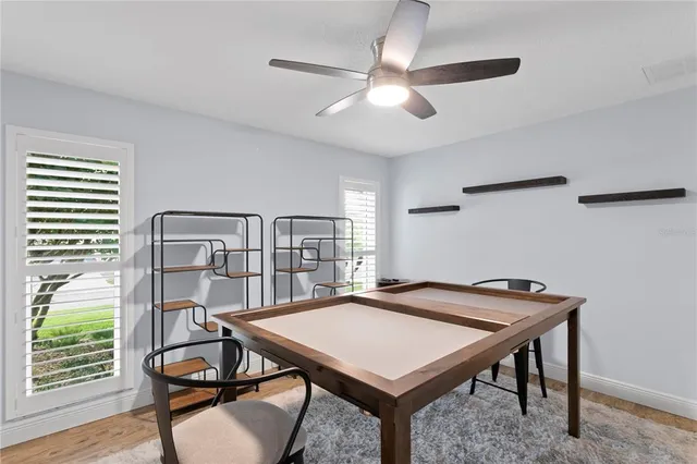 an aerial view of lake and residential houses with outdoor space