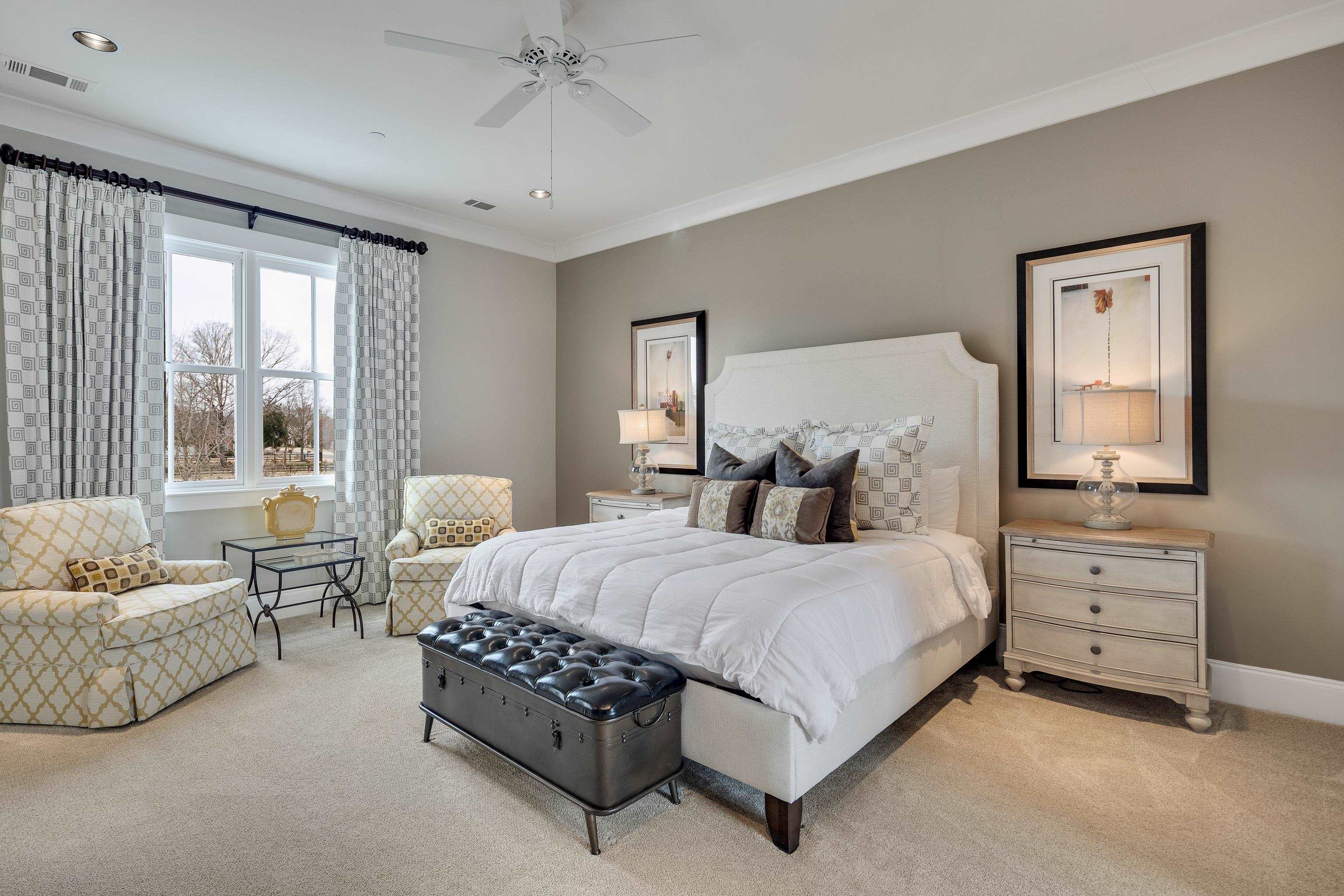 770 Ballard Road Piperton, TN 38017 - Photo 27 of 40 a spacious bedroom with a bed and a couch