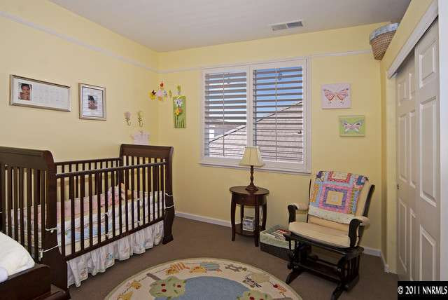 1712 Cavern Drive Reno, NV 89521 - Photo 8 of 13 a bedroom with furniture and a window