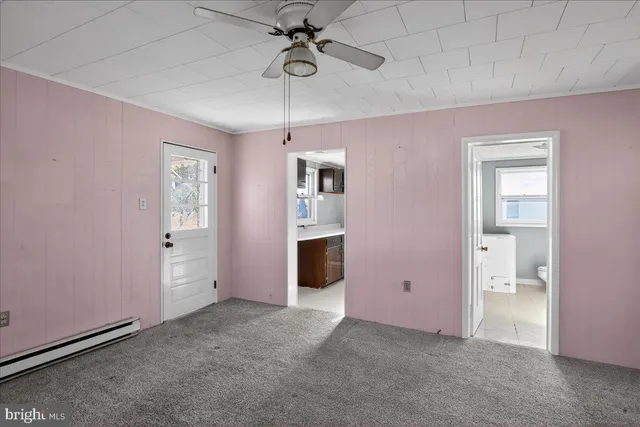 a view of a livingroom with a wooden door