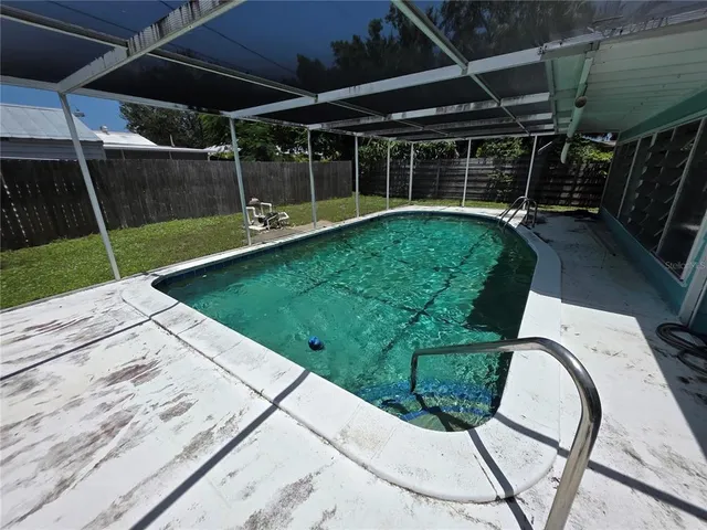 a view of a backyard with sitting area