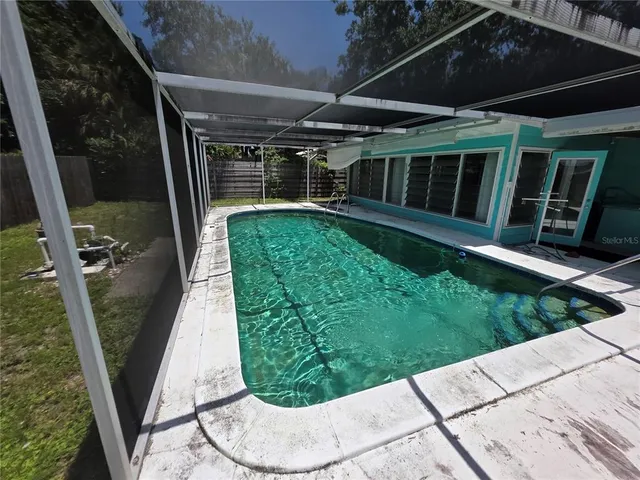 a view of a backyard with sitting area