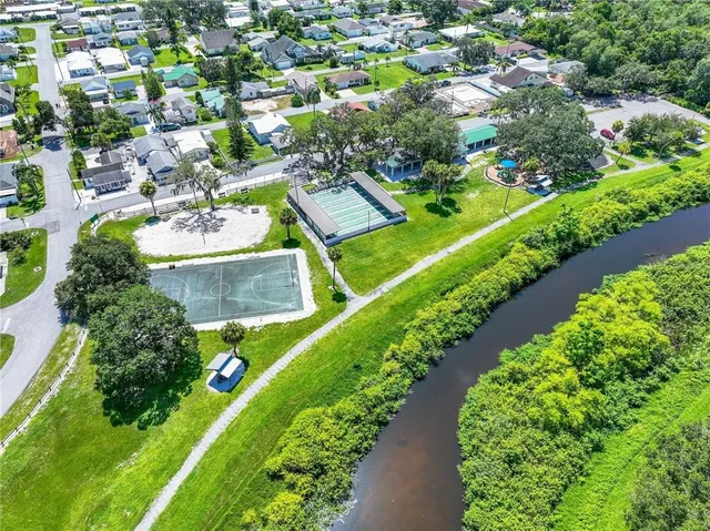 an aerial view of a house with a garden and swimming pool
