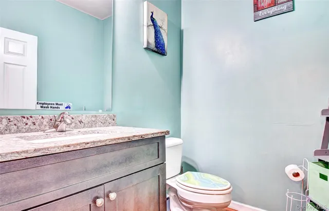 a view of a hallway with furniture and entryway