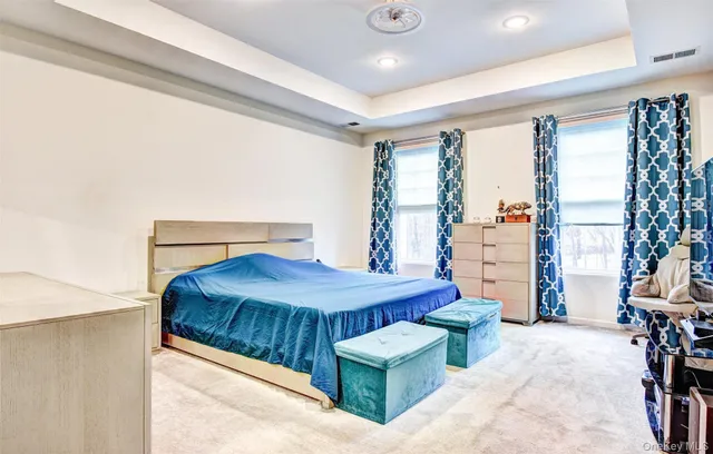 a bathroom with a granite countertop sink and a toilet