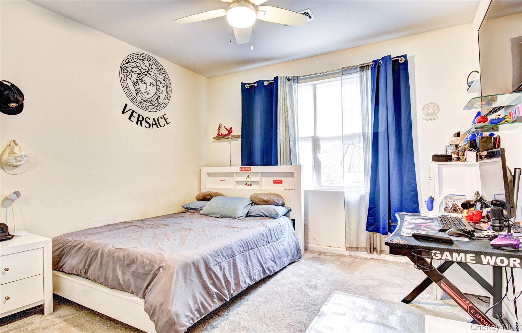 17 Magnolia Park Road Middletown, NY 10940 - Photo 22 of 35 a bedroom with a bed and a table in it with window