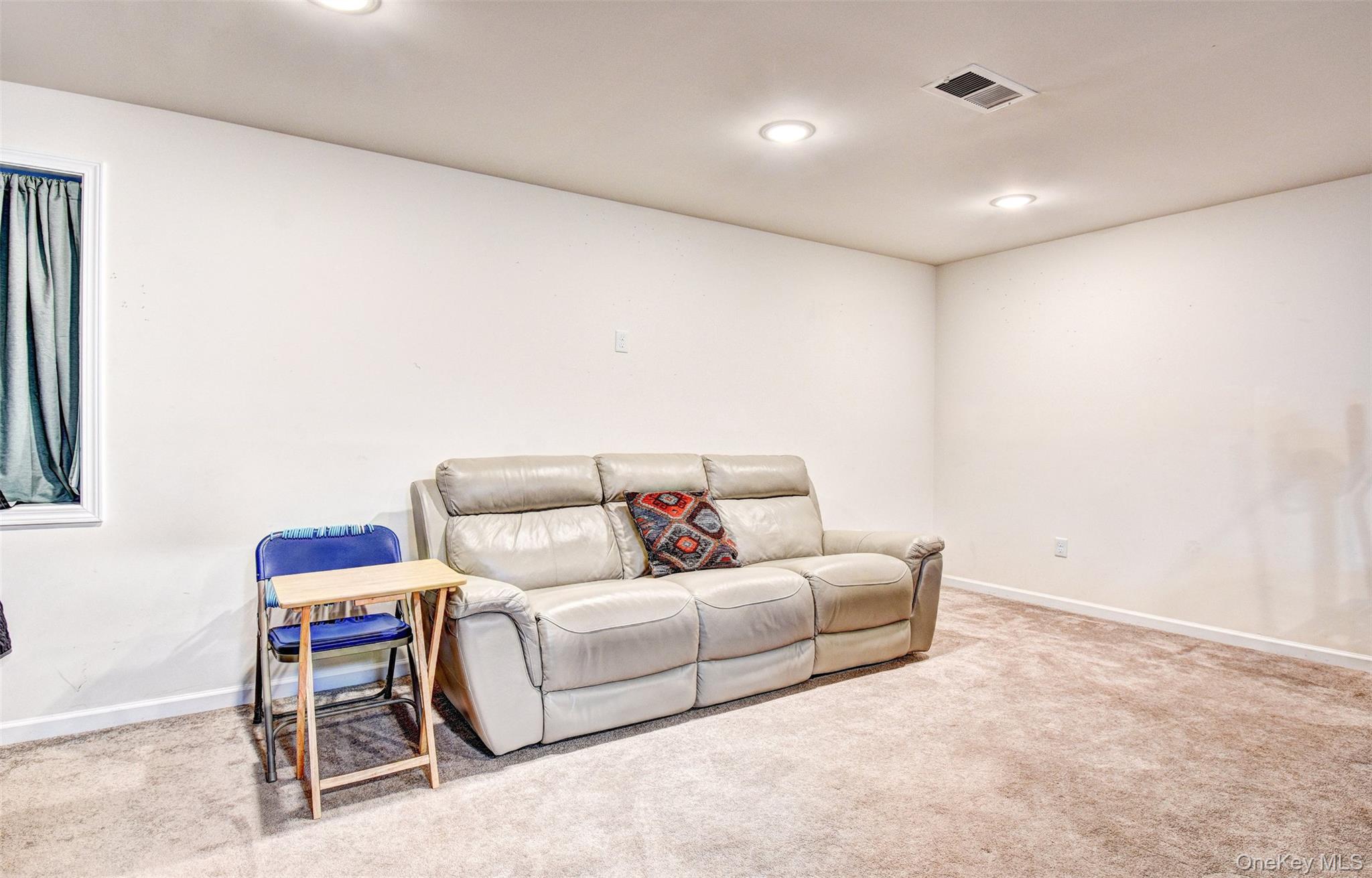 17 Magnolia Park Road Middletown, NY 10940 - Photo 26 of 35 a living room with furniture and a couch