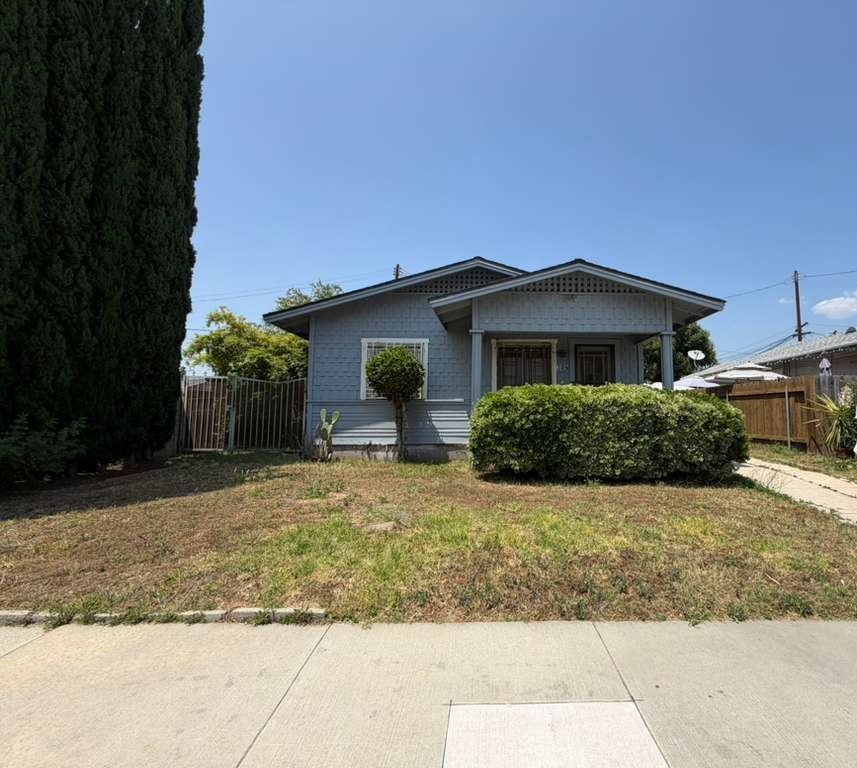 309 Alhambra Road Alhambra, CA 91801 - Photo 1 of 10 a front view of a house with a yard and garage