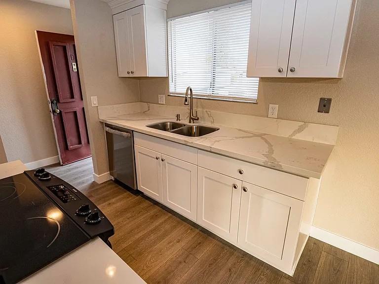 1091 Reed Avenue, Unit D Sunnyvale, CA 94086 - Photo 2 of 11 a kitchen with stainless steel appliances a sink stove and cabinets