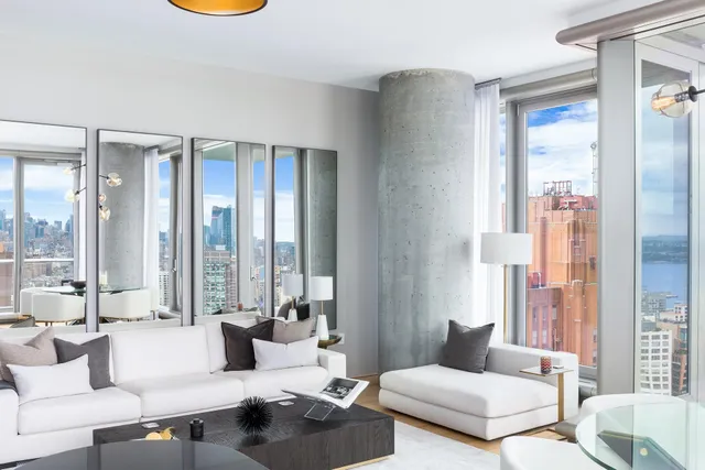 a kitchen with a sink a stove and chairs