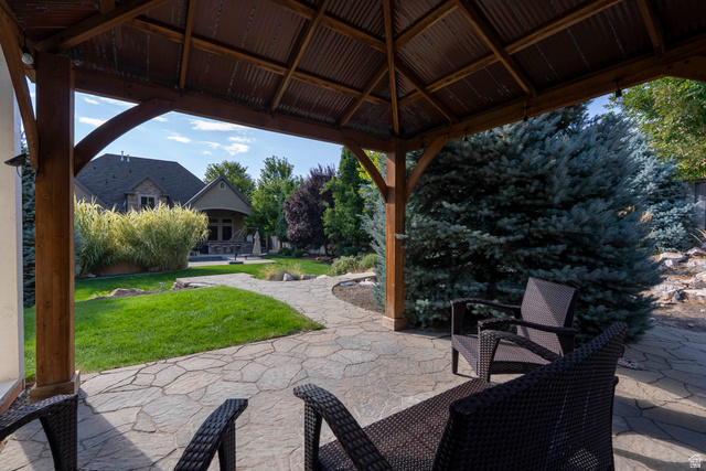 687 South 2080th Street East Springville, UT 84663 - Photo 107 of 149 Covered outdoor living space featuring a wood-beam gazebo with a corrugated metal roof