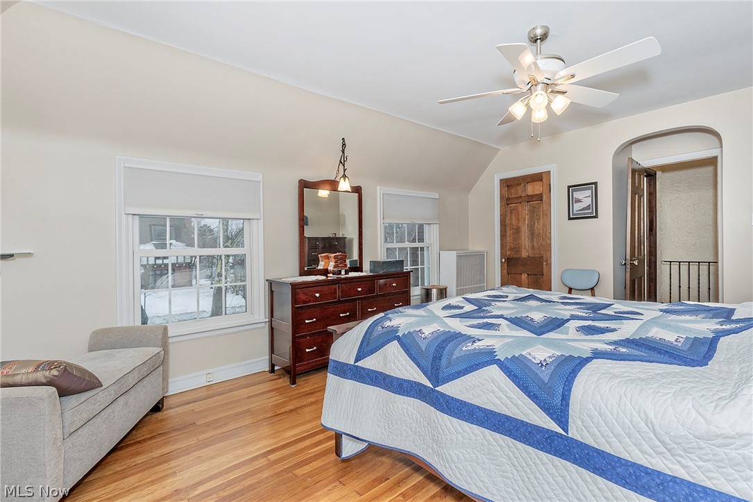 3259 Avalon Road Cleveland, OH 44120 - Photo 20 of 31 Bedroom with light wood flooring, lofted ceiling, and ceiling fan