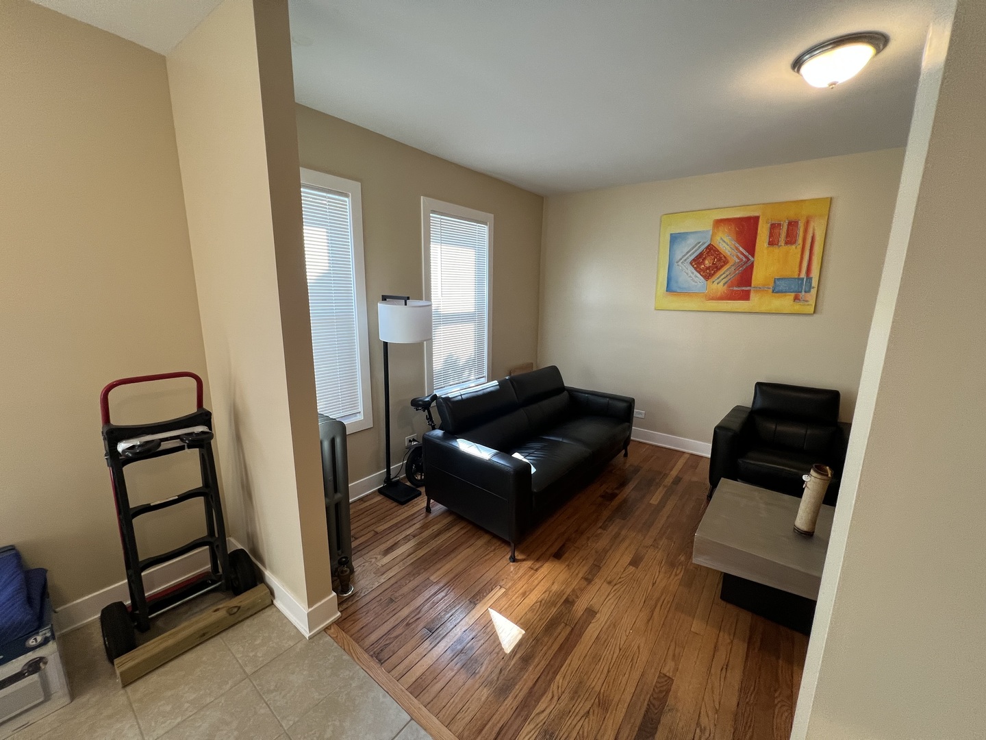 7506 South Vernon Avenue, Unit 3C Chicago, IL 60619 - Photo 6 of 10 a living room with furniture and a rug