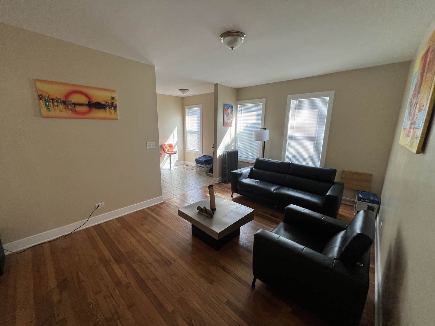7506 South Vernon Avenue, Unit 3C Chicago, IL 60619 - Photo 10 of 10 a living room with furniture and wooden floor