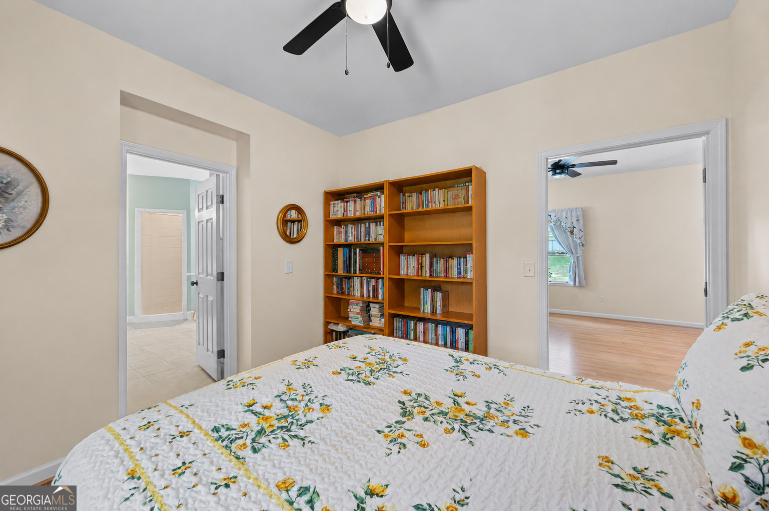 8080 Milford Road Gainesville, GA 30506 - Photo 50 of 82 a bedroom with a bed a dresser and a book shelf