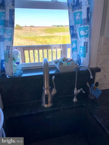 a bathroom with a sink toilet and mirror