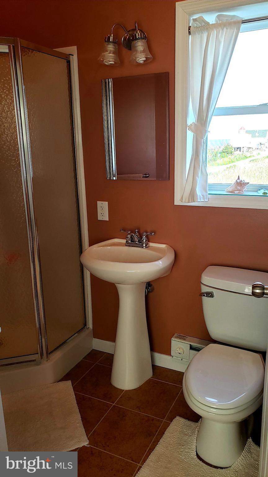 68 Bay Avenue Heislerville, NJ 08324 - Photo 34 of 52 a bathroom with a sink toilet and mirror