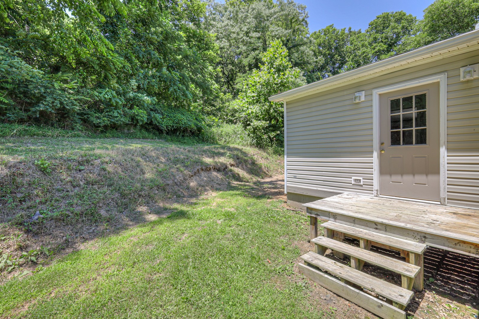 4002 Rippey Lake Road Mount Pleasant, TN 38474 - Photo 8 of 43 a view of a backyard with stairs