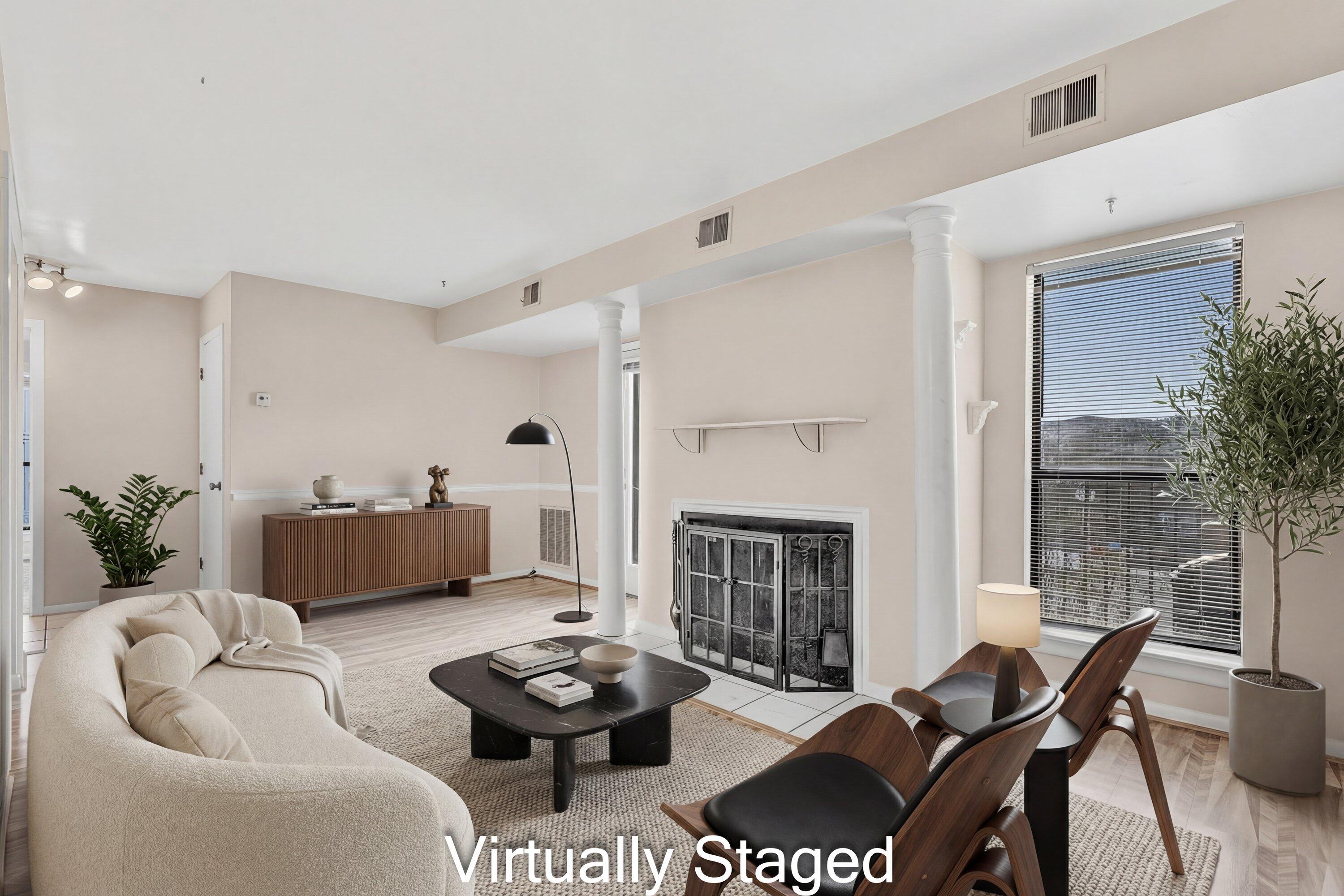 a living room with furniture and a fireplace