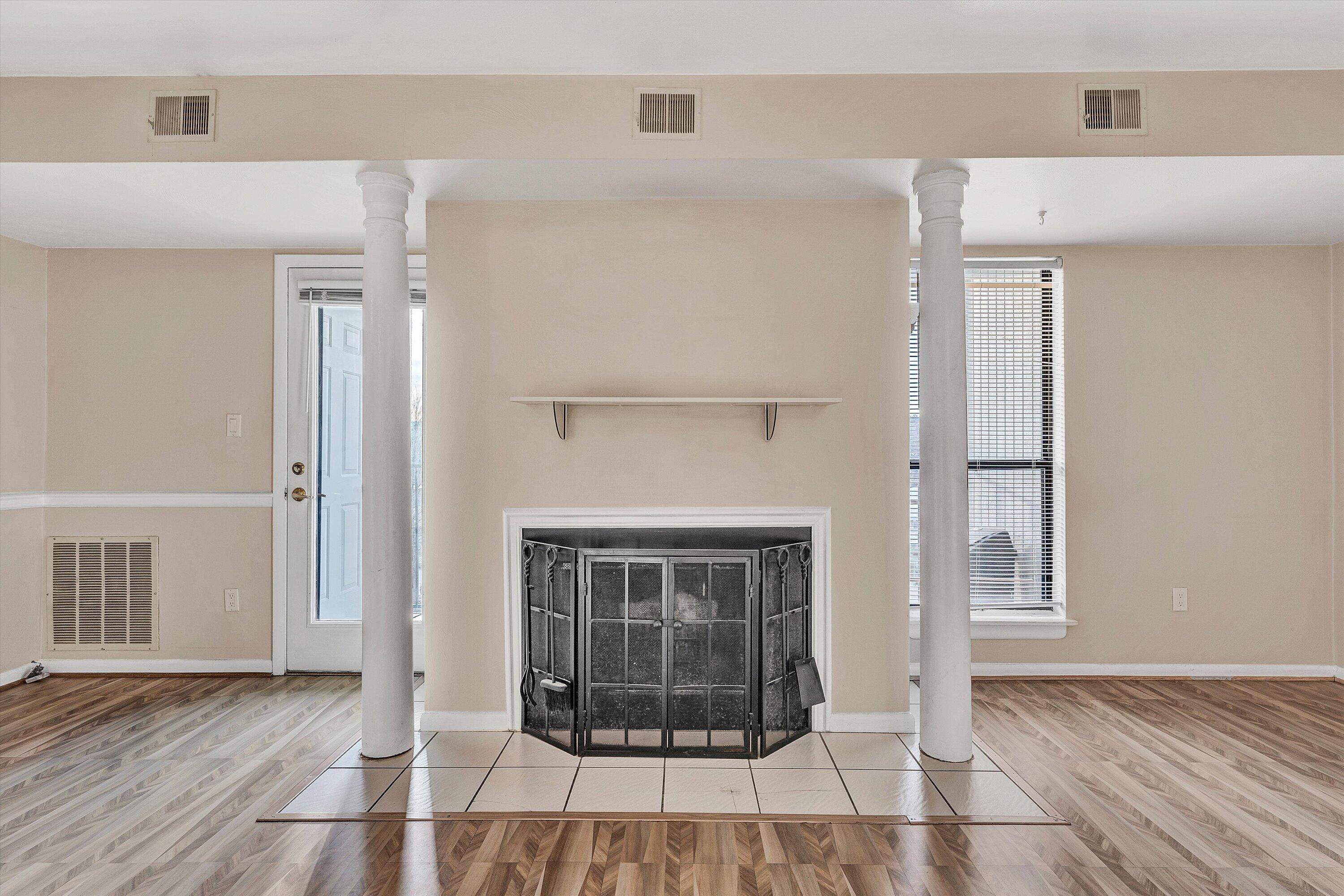 3554 Timberline Trail Roanoke, VA 24018 - Photo 11 of 20 a view of an empty room with wooden floor fireplace and a window
