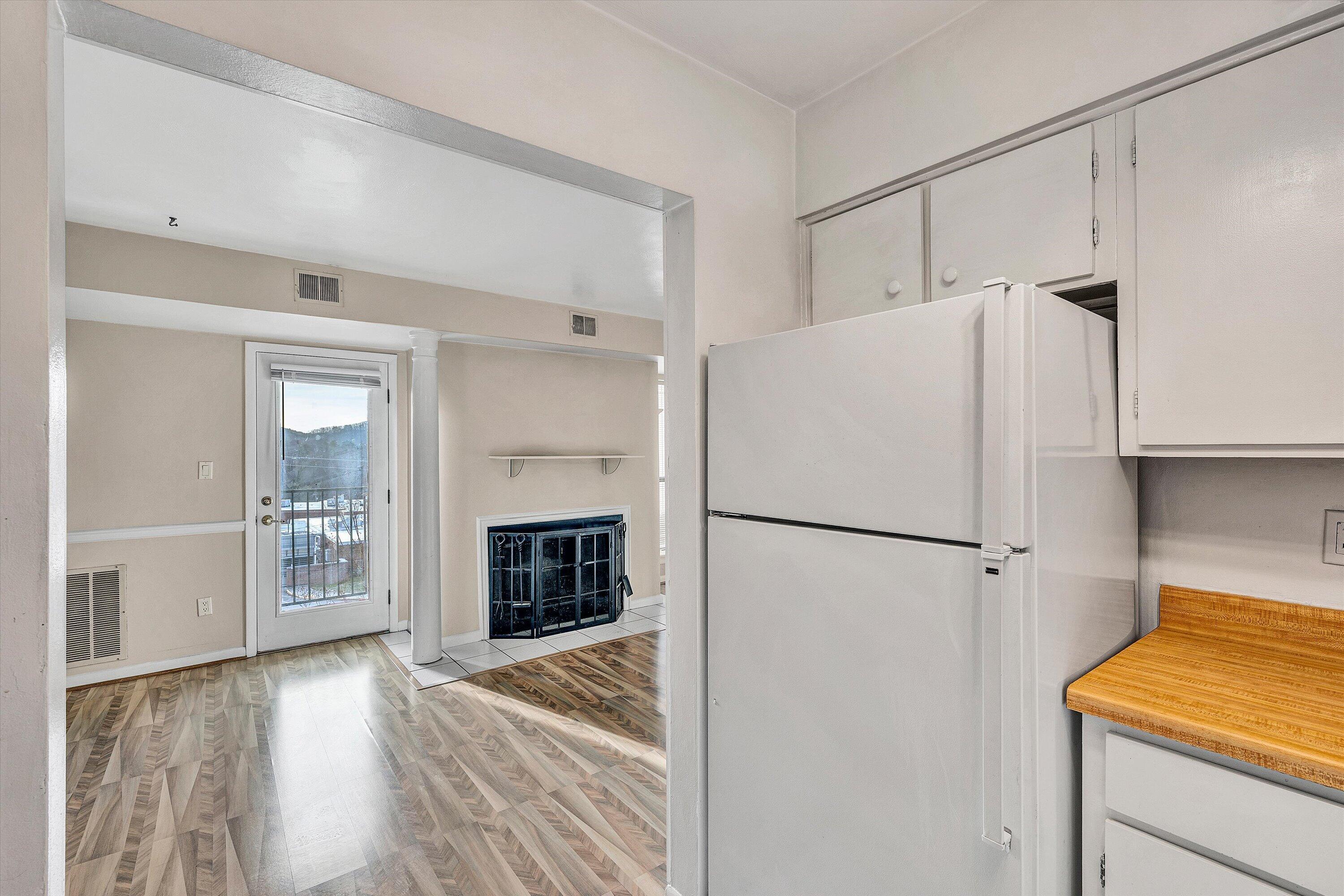3554 Timberline Trail Roanoke, VA 24018 - Photo 13 of 18 a white refrigerator freezer and a stove sitting inside of a kitchen