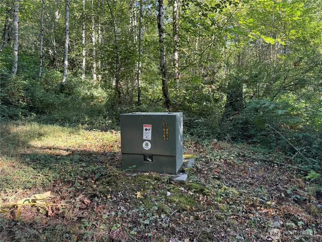 a backyard of a house with a yard and outdoor seating