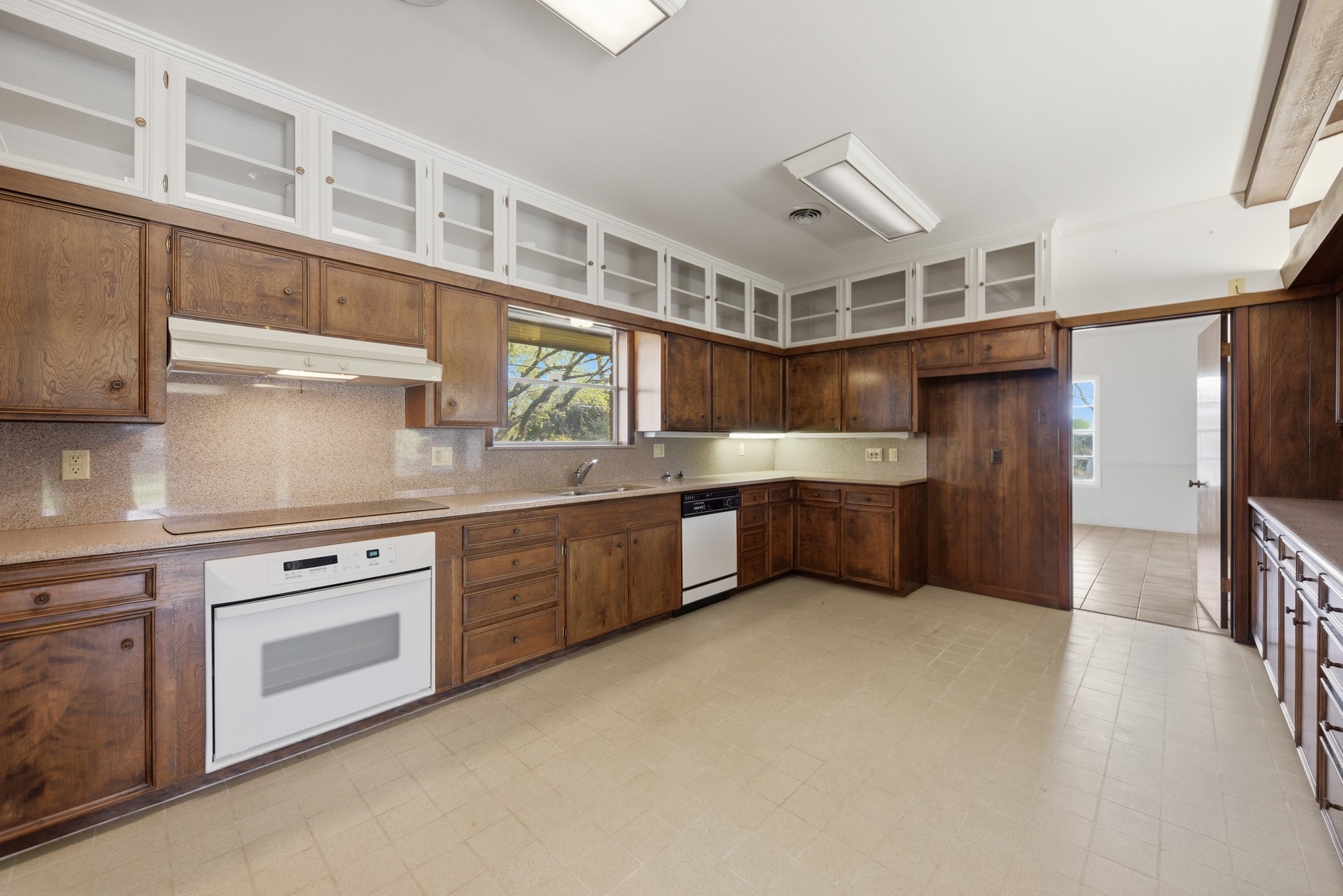 1500 Key Street Brenham, TX 77833 - Photo 17 of 41 a kitchen with stainless steel appliances granite countertop a stove a sink and a refrigerator