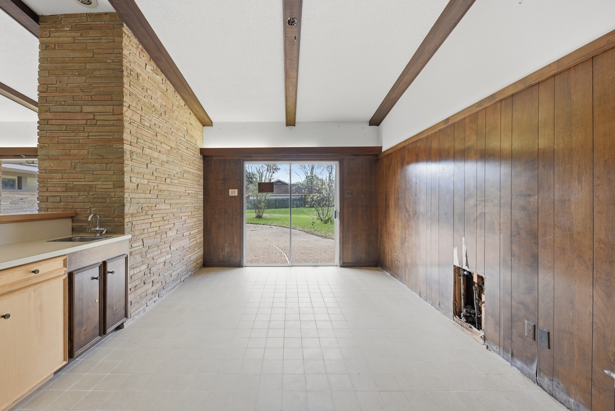 1500 Key Street Brenham, TX 77833 - Photo 19 of 41 a view of a hallway with a sink and a window