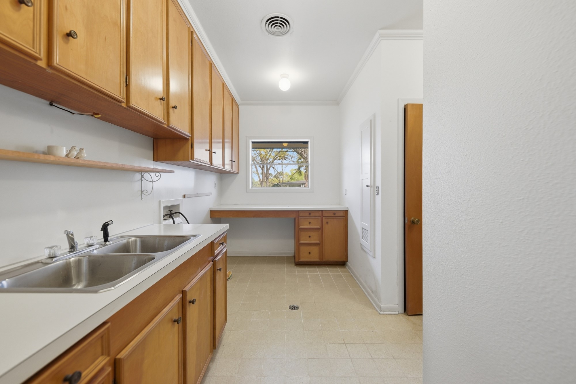 1500 Key Street Brenham, TX 77833 - Photo 21 of 41 a kitchen with sink a refrigerator and cabinets