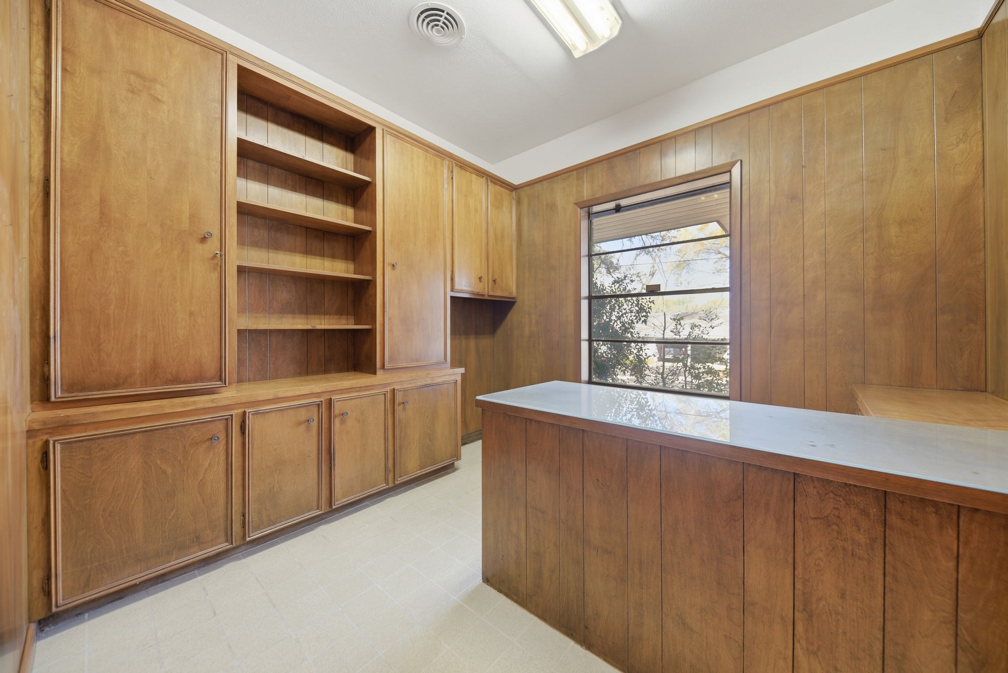 1500 Key Street Brenham, TX 77833 - Photo 22 of 41 a kitchen with cabinets and window