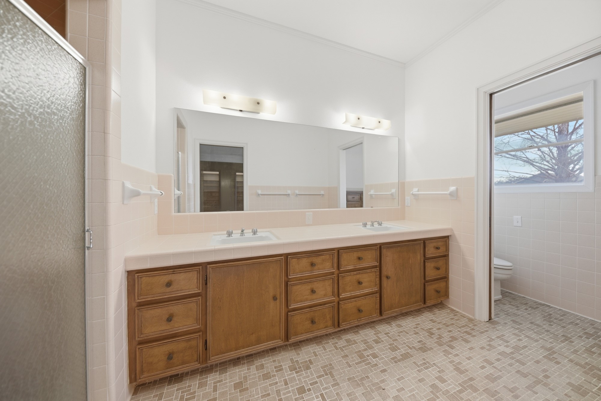 1500 Key Street Brenham, TX 77833 - Photo 30 of 41 a bathroom with a double vanity sink and a mirror