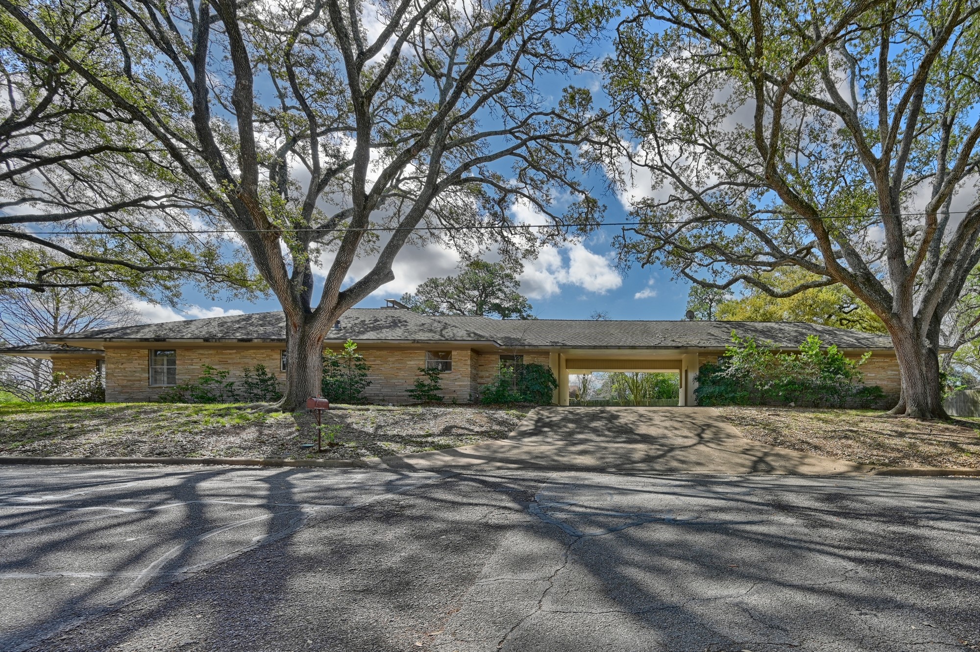 1500 Key Street Brenham, TX 77833 - Photo 37 of 41 a wooden bench sitting in front of a house