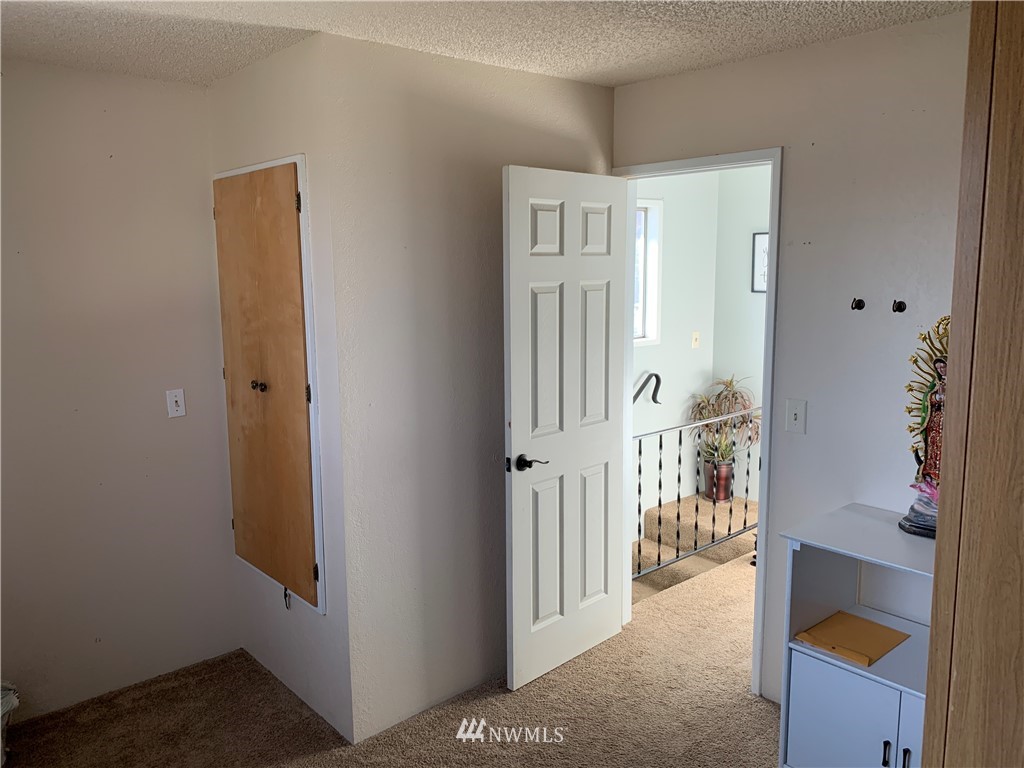 353 Maringo Road Ephrata, WA 98823 - Photo 13 of 20 a view of a hallway with a door and stairs