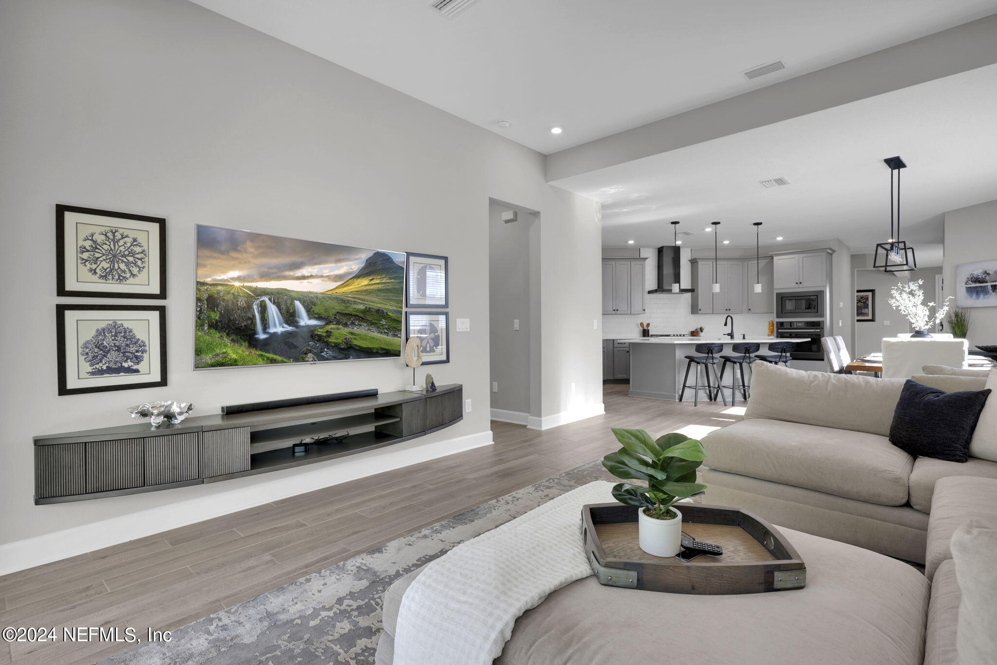 175 Windswept Way Street St. Augustine, FL 32092 - Photo 12 of 80 a living room with furniture and a flat screen tv