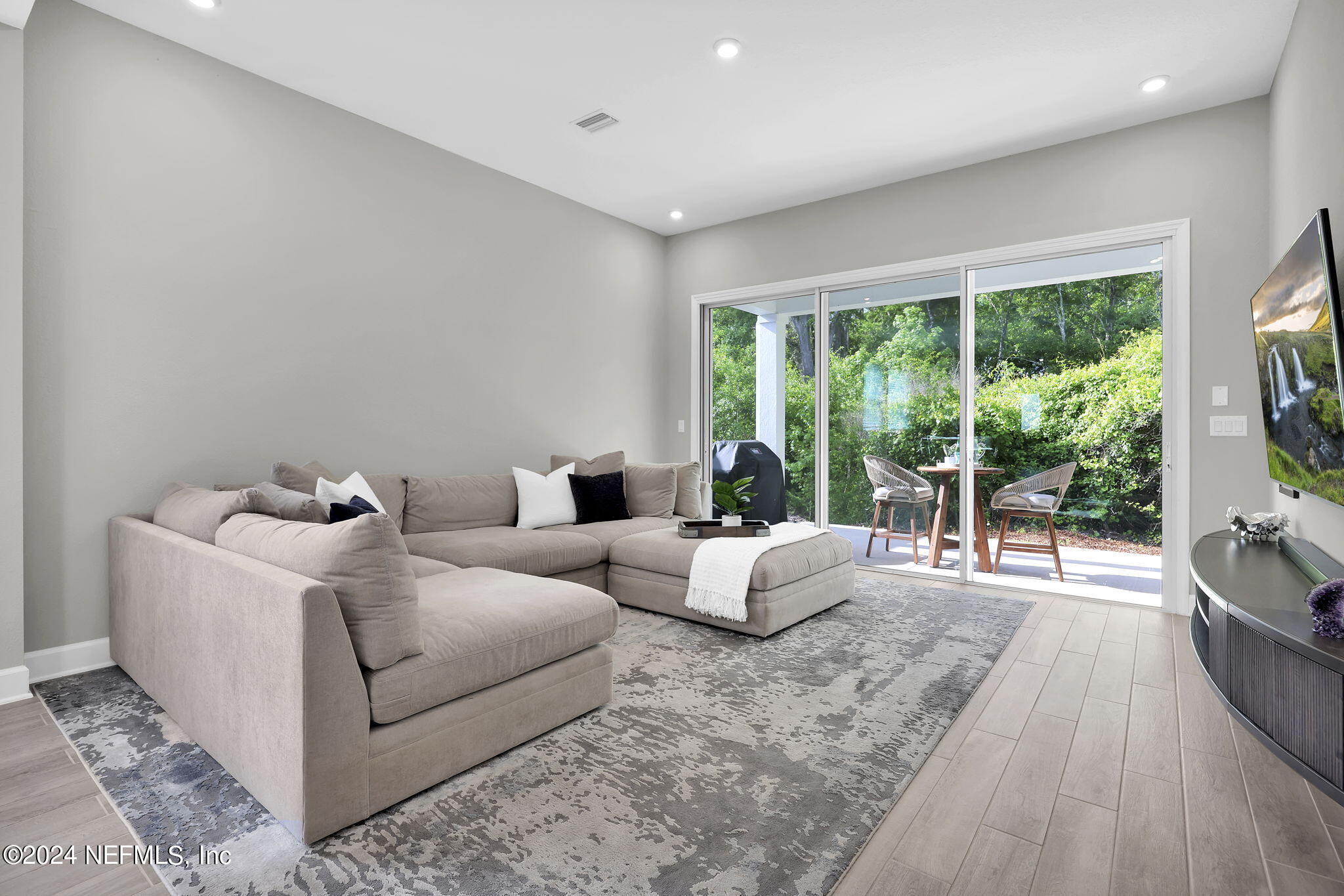 175 Windswept Way Street St. Augustine, FL 32092 - Photo 13 of 80 a living room with furniture and a large window