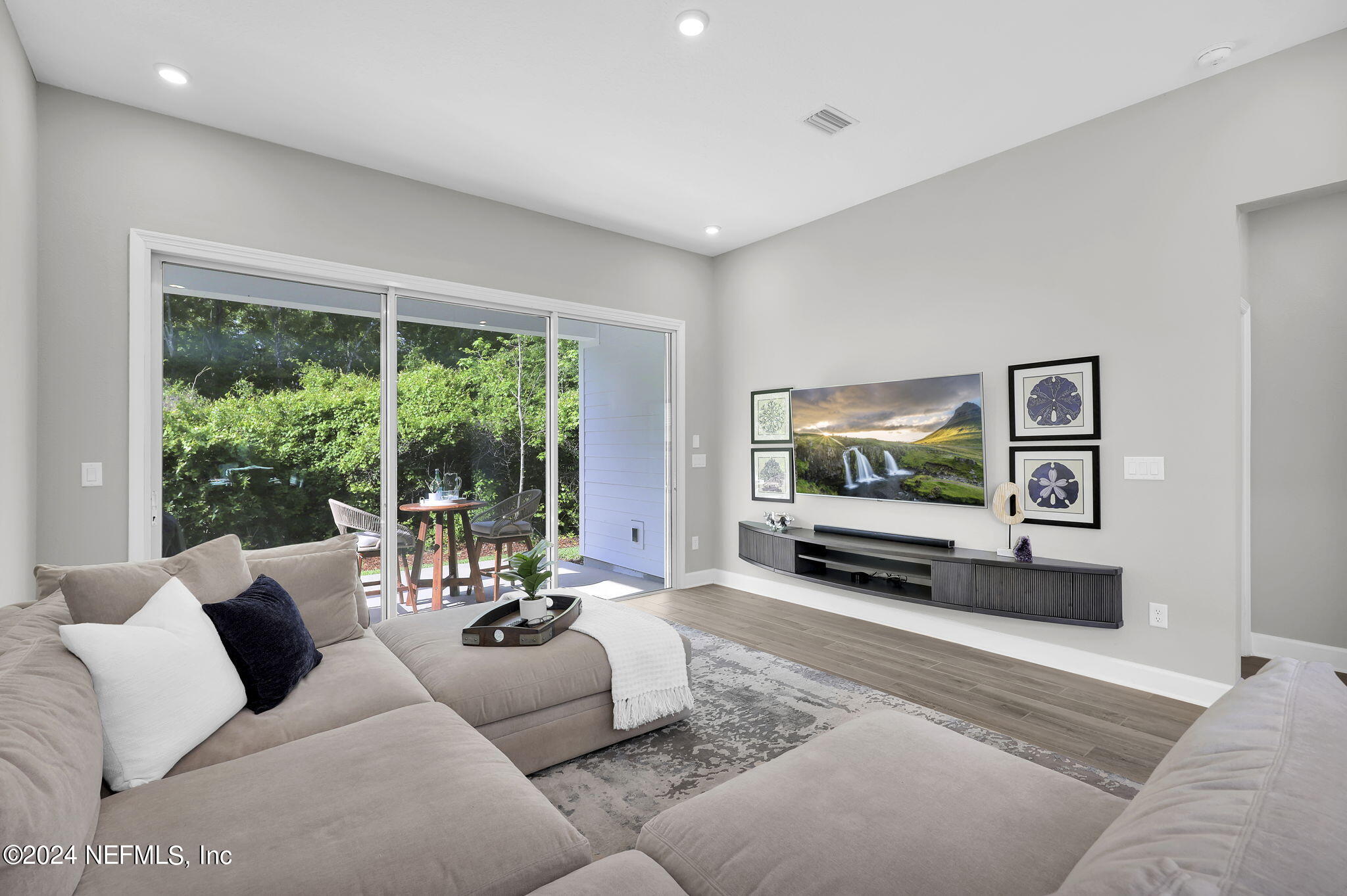 175 Windswept Way Street St. Augustine, FL 32092 - Photo 14 of 80 a living room with furniture and a flat screen tv