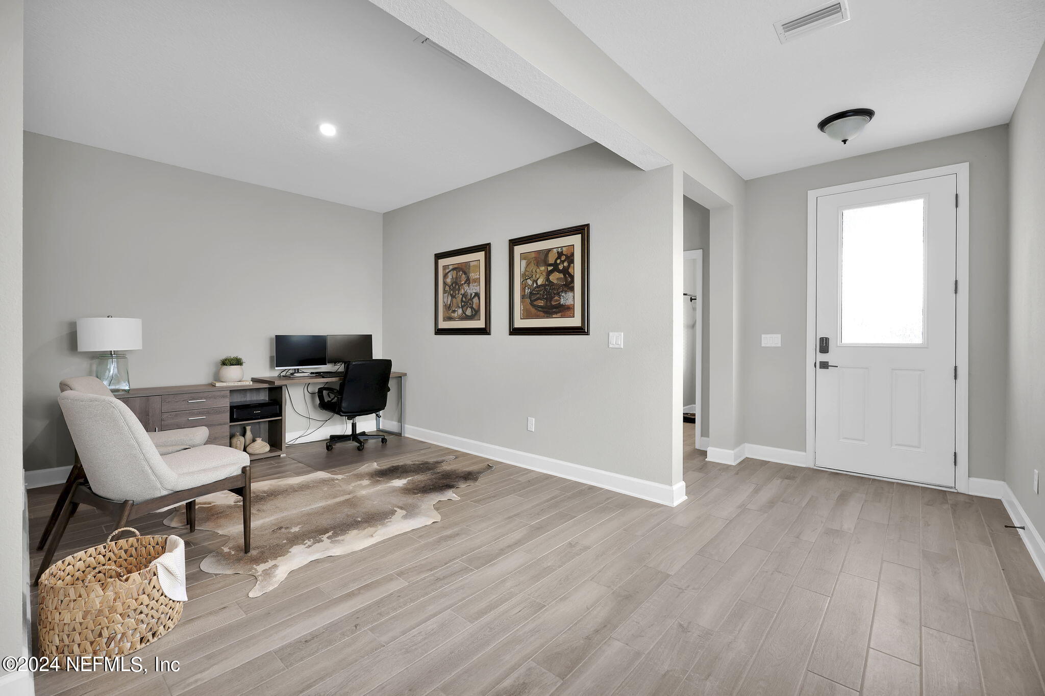 175 Windswept Way Street St. Augustine, FL 32092 - Photo 16 of 80 a view of workspace room with wooden floor and lounge chair