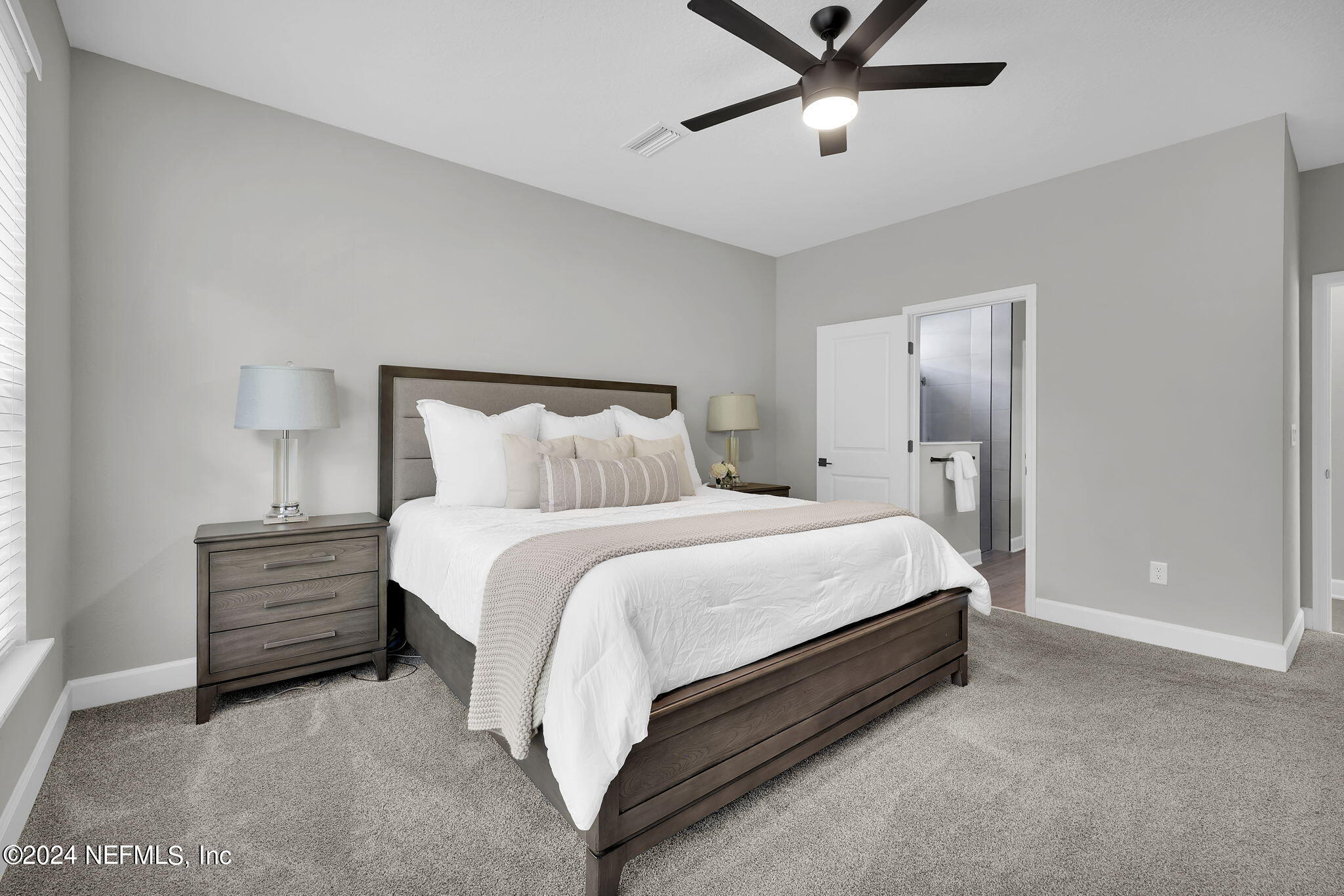 175 Windswept Way Street St. Augustine, FL 32092 - Photo 18 of 80 a spacious bedroom with a bed and ceiling fan